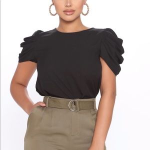 Puff/ ruffle sleeve black blouse. Dressy top new never worn.